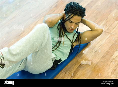 Man Doing Sit Ups Stock Photo Alamy