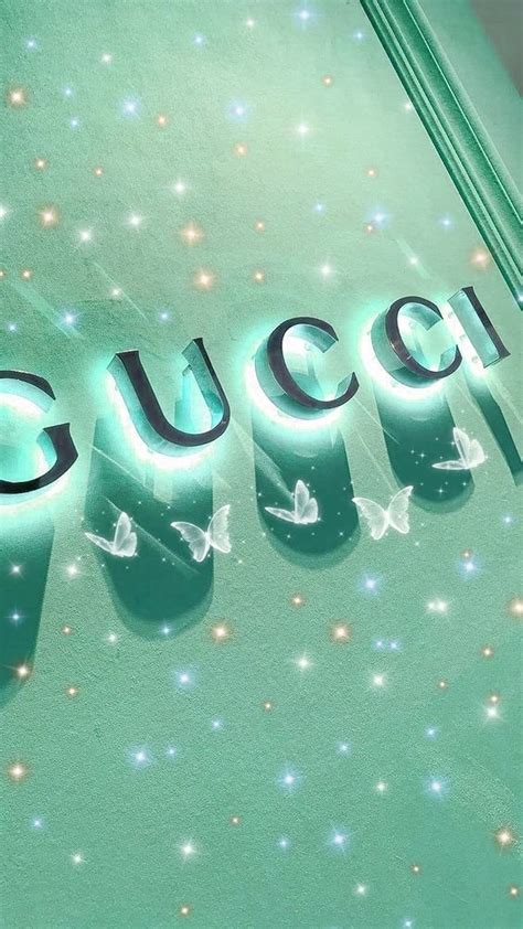 The Word Gucci Spelled With Butterflies In Front Of A Green Wall And Star Filled Background