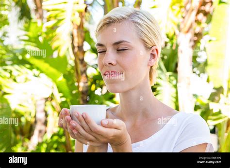Attractive Blonde Woman Holding Mug Stock Photo Alamy