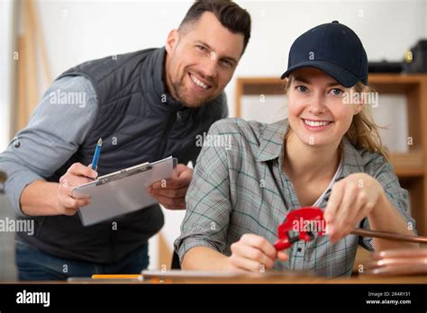 Mechanic And Apprentice Soldering Cooper Pipes Stock Photo Alamy