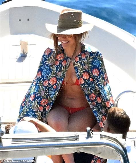 Jennifer Lopez Shows Off Her Famous Curves In A Skimpy Red Bikini While Soaking Up The Sun On