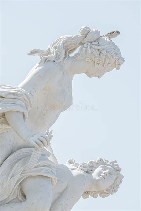 Old Statue Of A Sensual Naked Renaissance Era Women With A Bird Sparrow