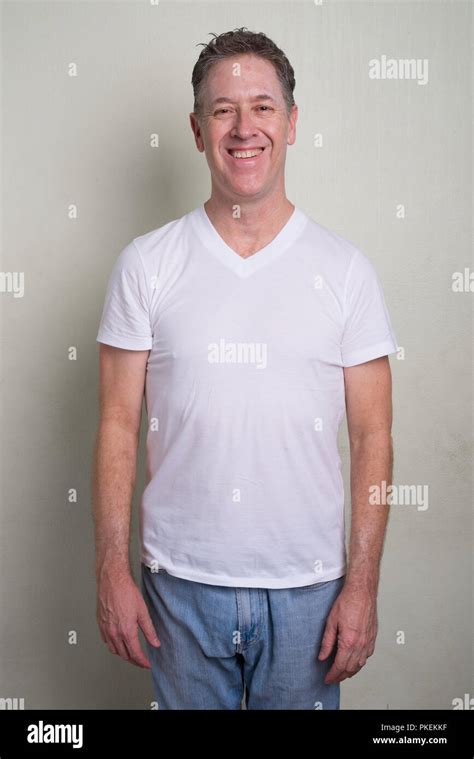 Portrait Of Mature Man With Gray Hair Against White Background Stock Photo Alamy