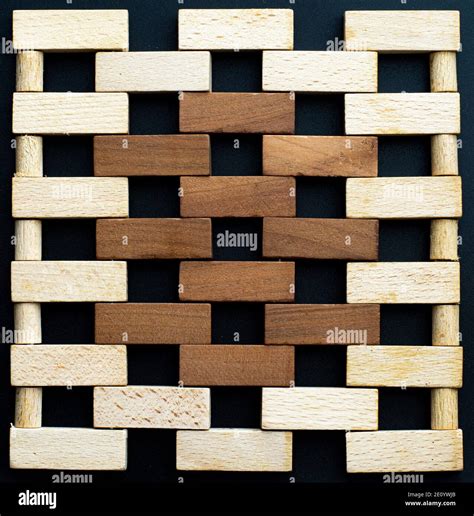 Wall made of small wooden bricks. Brown and natural wooden blocks ...