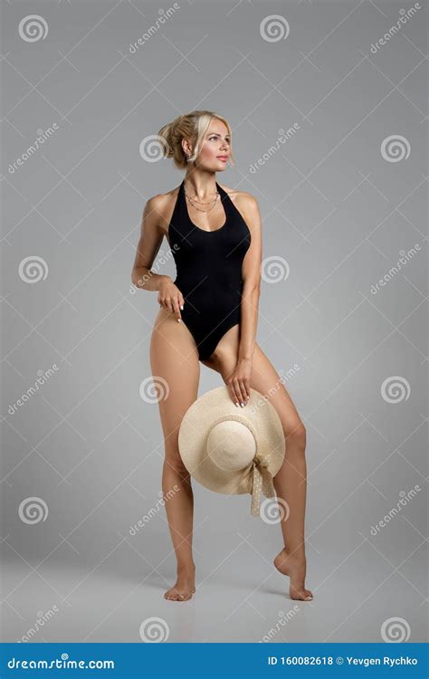 Slim Woman Blonde In Black Bodysuit With Straw Hat Stock Photo Image Of Posing Sensual