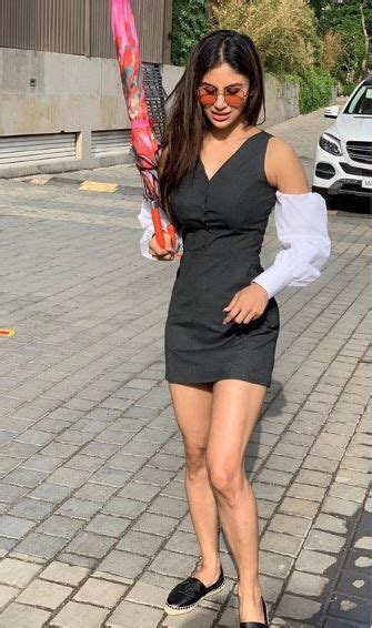 Mouni Roy Looks Stunning In Black Dress And Nude Makeup As She Strikes A Pose With An Umbrella