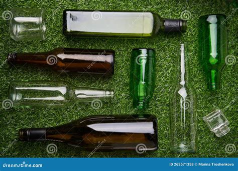 Separate Collection Of Glass Garbage Recyclable Glass Waste On Green