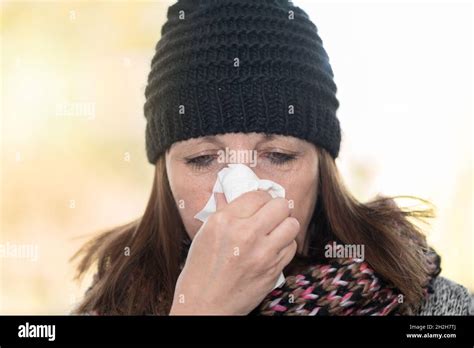 Mature Woman Blowing Her Nose Stock Photo Alamy