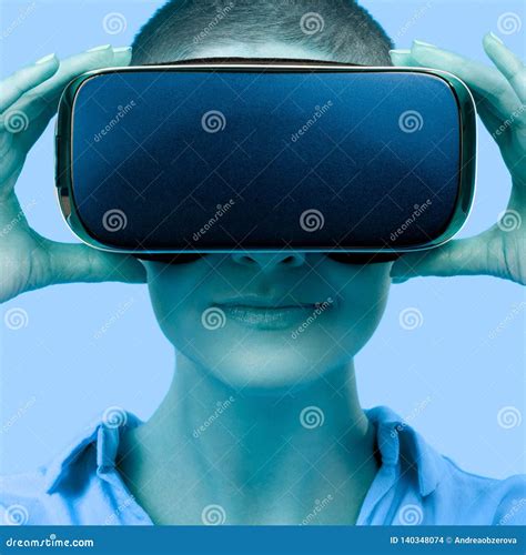 Young Woman Wearing Virtual Reality Goggles. Woman Wearing VR Glasses