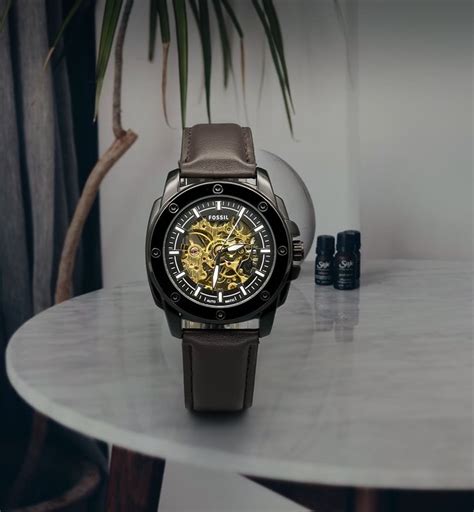 brown fossil automatic  size mm  rs    delhi id