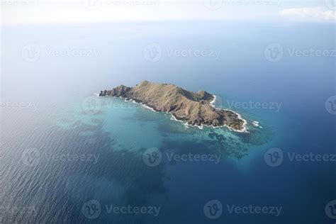 Aerial view of a small island in the middle of the ocean. AI Generated
