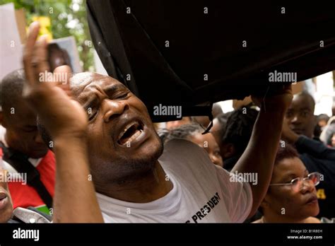 Anti Mugabe Protesters Carry Coffin Outside South Africa House London