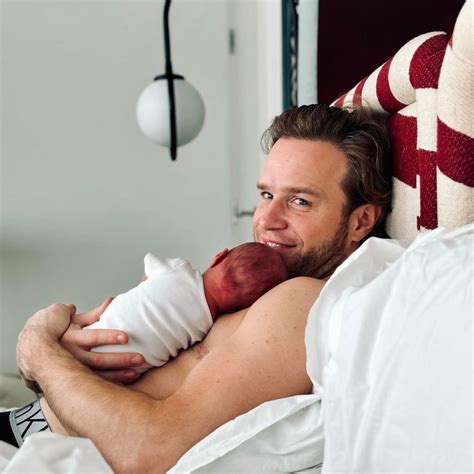Olly Murs is a doting dad as he cradles baby daughter Madison in new