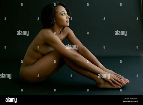 Nude African American Woman Sitting On Studio Floor Stock Photo Alamy