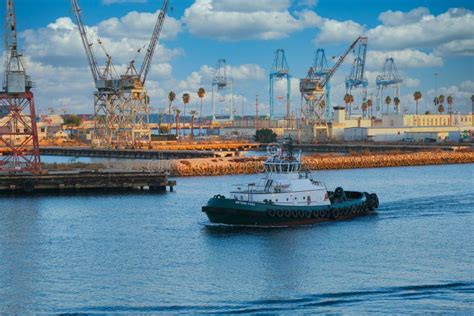 Tugboat Past Shipping Harbor Editorial Photo Image Of Fuel Crane