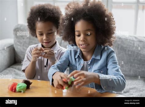 Close Up Little African American Kids Playing With Colorful Plasticine