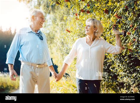 Mature Woman And Man Having A Summer Walk In The Countryside Stock Photo Alamy