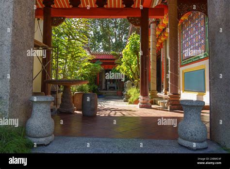 Traditional Courtyard With Columns Stone Furniture And Plants Under