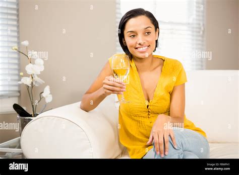 Smiling Brunette Holding Glass Of White Wine Stock Photo Alamy
