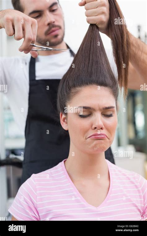 Sad Brunette Getting Her Hair Cut Stock Photo Alamy