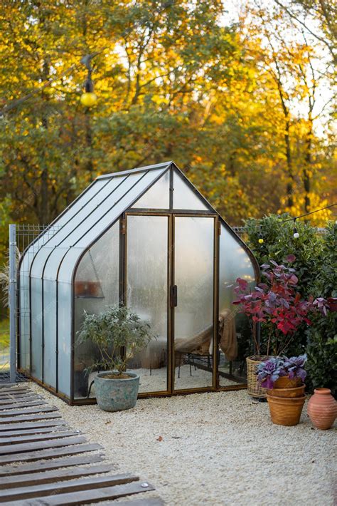 Premium Photo | Vintage greenhouse in backyard