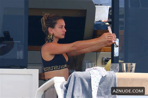 Sam Faiers Showing Off Her Toned Physique In A Plunging Black Versace Bikini During Luxury Trip