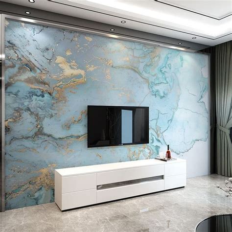 A Modern Living Room With Marbled Walls And White Furniture Including