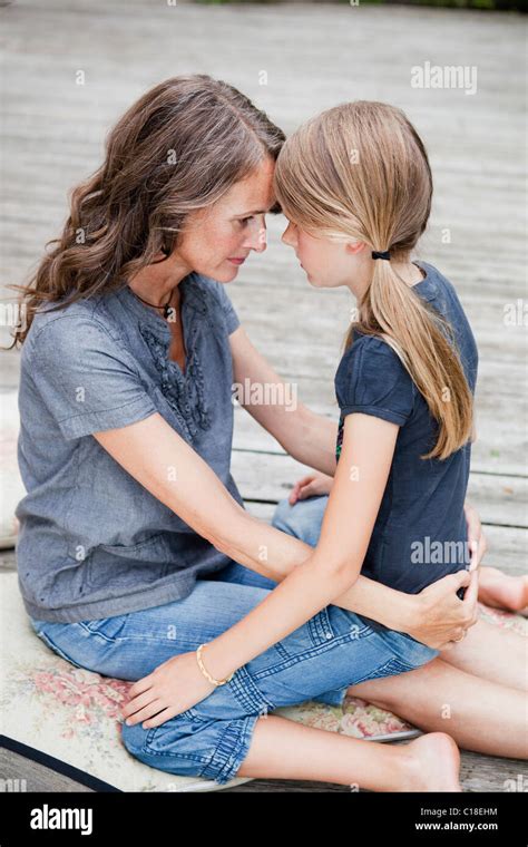 Mother And Daughter Cuddling Stock Photo Alamy