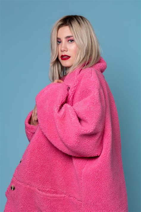 Beautiful Blonde Fashion Model Seductively Posing In Pink Coat Stock Image Image Of