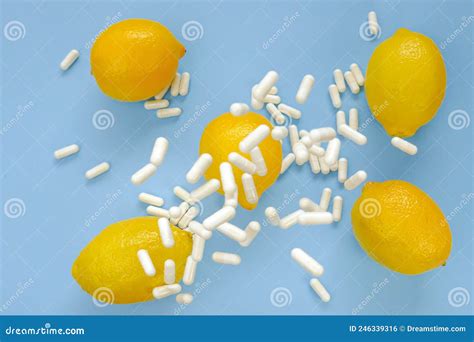 Vitamin C Pills.Flying Vitamin C White Tablets and Yellow Lemons on a ...