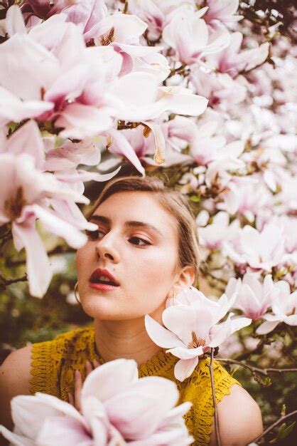 Premium Photo Young Woman Amidst Pink Flowers