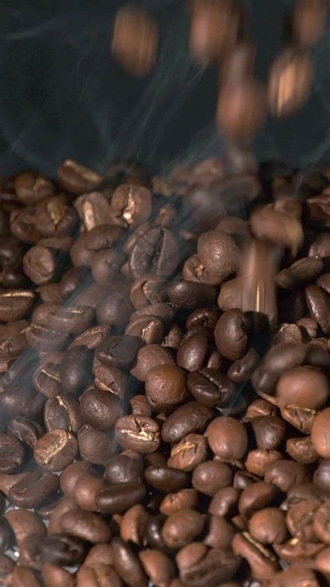 Vertical Slow Motion Of Roasted Coffee Beans Falling Organic Coffee