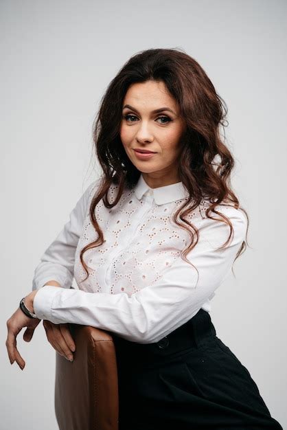 Premium Photo Caucasian Curly Hair Brunette With Blue Eyes And Nude Make Up With In The White