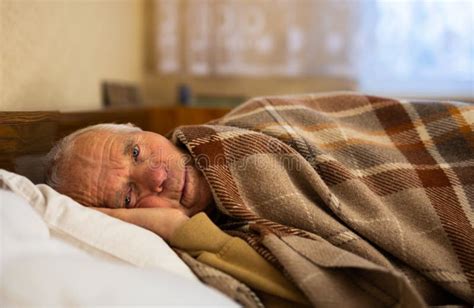 Mature Senor Tries To Sleep In His Bed In Bedroom Stock Image Image
