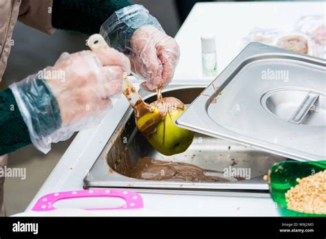 Making Chocolate Dipped Apple Stock Photo Alamy