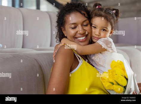 Positive Delighted Brunette Female Embracing Her Kid Stock Photo Alamy