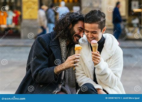 Gay Couple Smiling While Eating Ice Cream Together On The Street Stock Image Image Of Happy