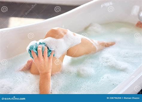 Skin Care Concept Young Adult Woman Taking Bath Lying In Soap Foam