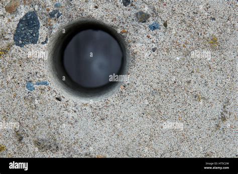 Hole In A Concrete Fence Stock Photo Alamy