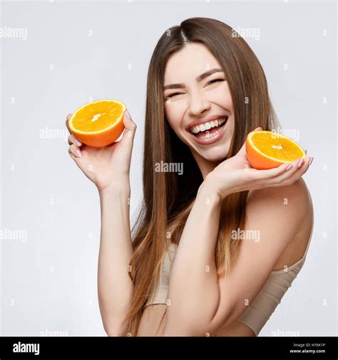 Beautiful Woman With Clean Fresh Skin Holding Orange Stock Photo Alamy