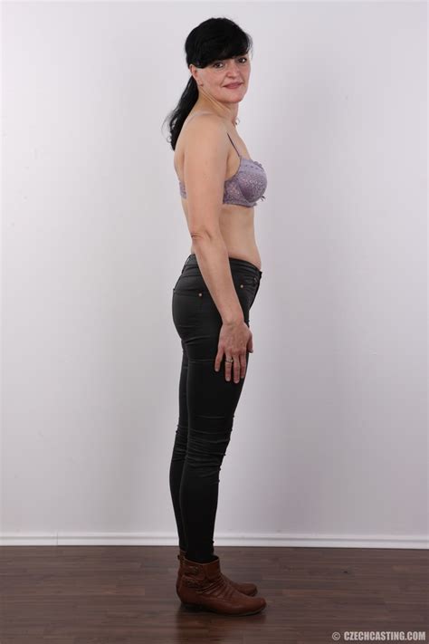 Mature Chick Slowly Peels Off Her Turquoise XXX Dessert Picture