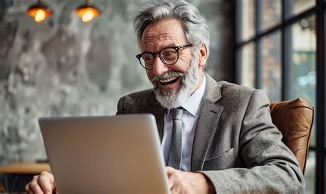 Happy Mature Business Man Looking At Laptop Computer Premium Ai Generated Image