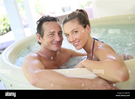 Romantic Couple Relaxing In Hot Tub Stock Photo Alamy