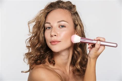 Premium Photo Beautiful Half Naked Woman Looking At Camera And Using Makeup Brush Isolated