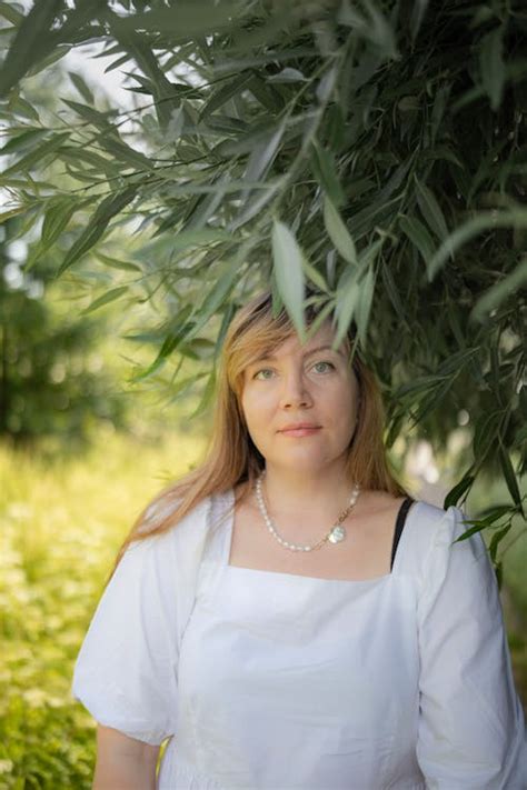 Portrait Of Woman Under Tree · Free Stock Photo