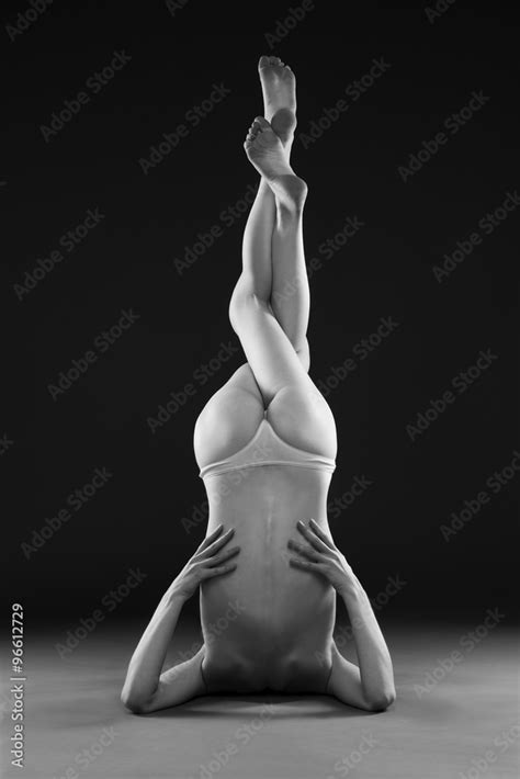 Naked yoga Beautiful sexy body of young woman on gray background Stock 사진 Adobe Stock