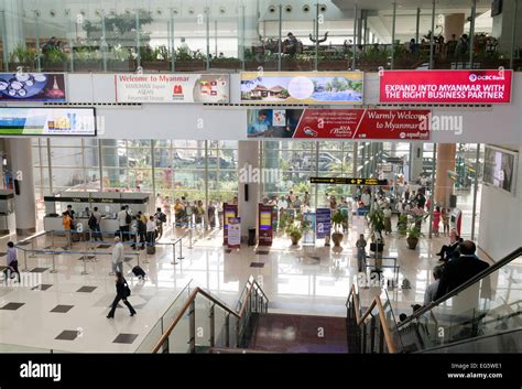 Passengers at Arrivals, terminal interior, Yangon international Airport ...