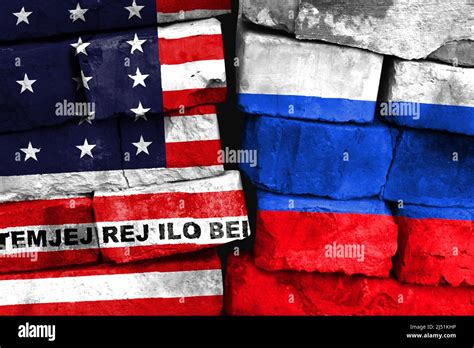 Concept Of The Relationship Between Bikini Atoll And Russia With Two Painted Flags On A Damaged