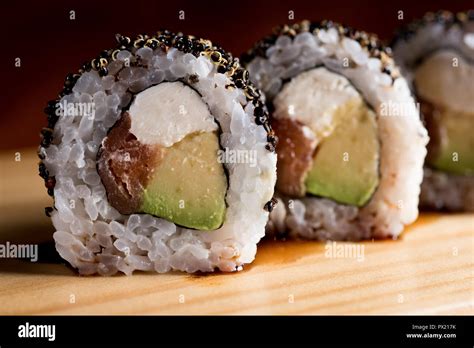 Sushi roll sushi with prawn, avocado, cream cheese, sesame. Sushi menu Stock Photo - Alamy