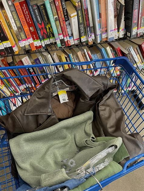 A Shopping Cart Filled With Lots Of Books